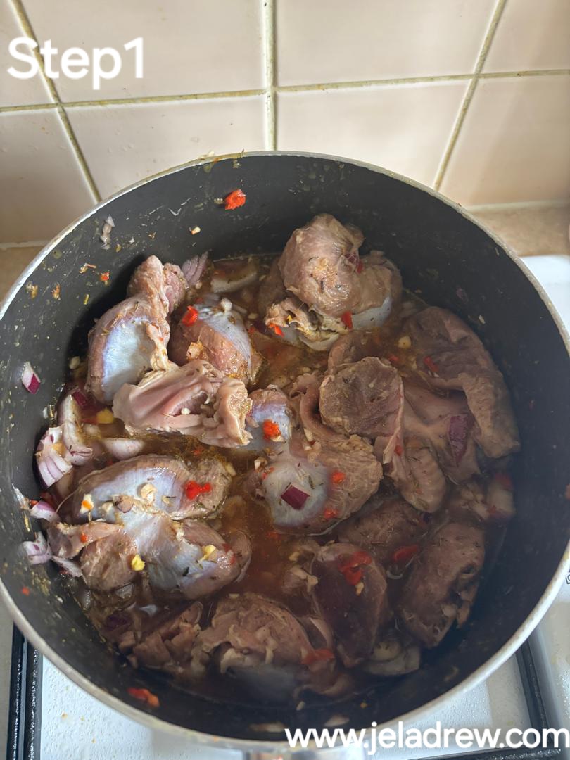 Preparing-and-seasoning-gizzards-for-boiling-with-onions-pepper-salt-thyme-and-curry. 
