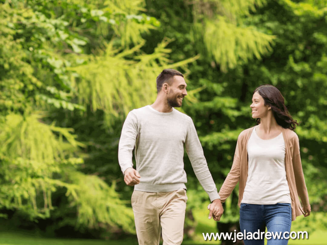 Happy-married-couple-walking-hand-in-hand-outdoors-symbolizing-faith-love-and-unity-in-marriage.