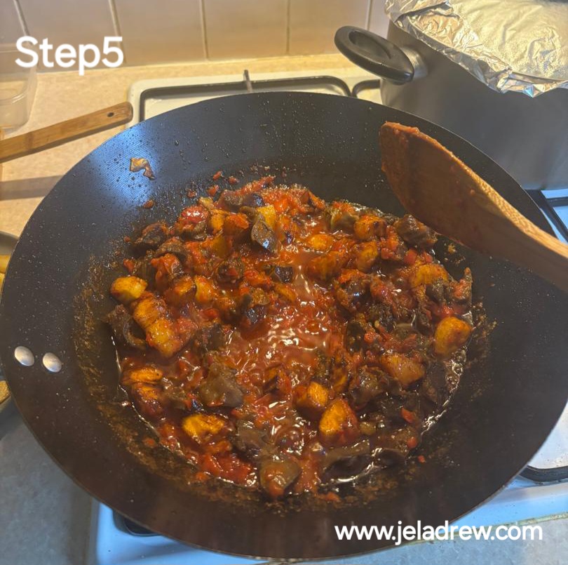 Fried-gizzards-and-plantain-simmering-in -spicy-tomato-sauce-in-a-pan