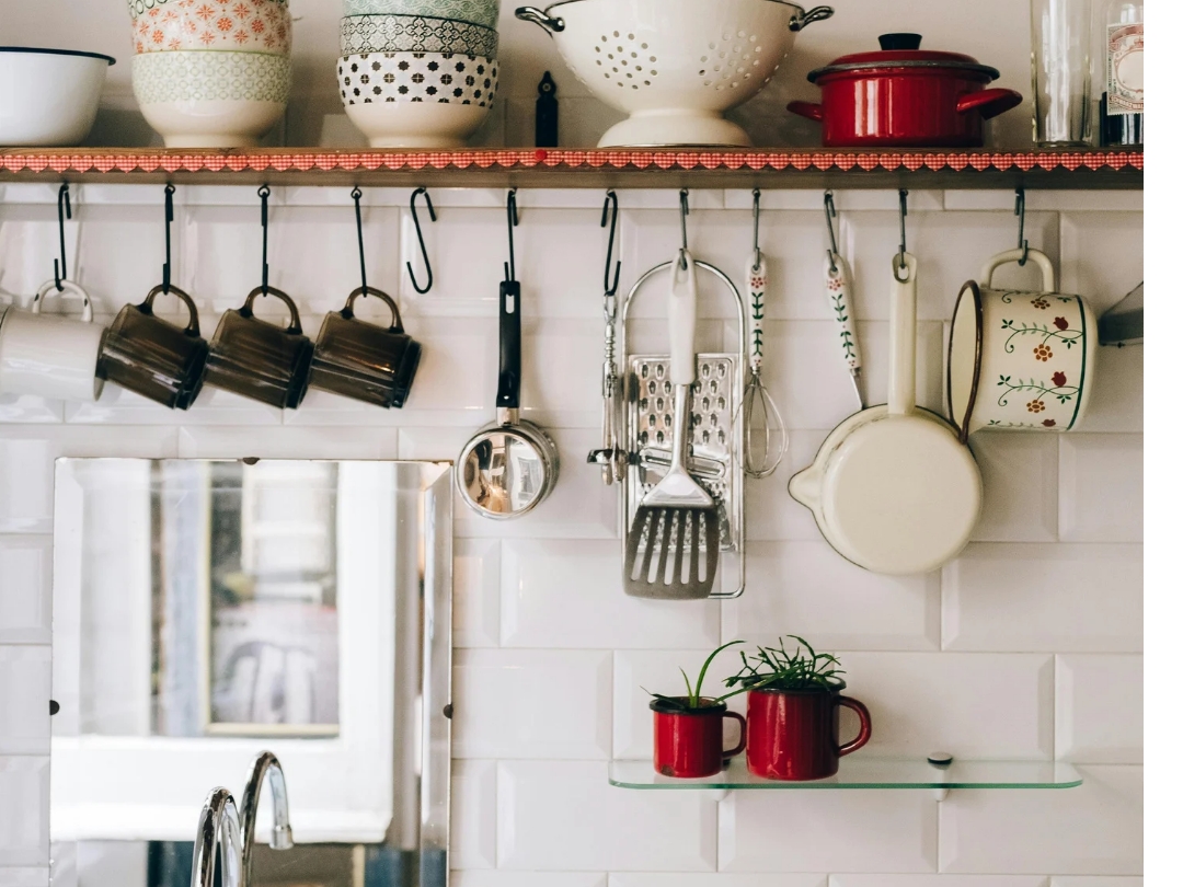 Pegboards-holding-kitchen-utensils-and-pans