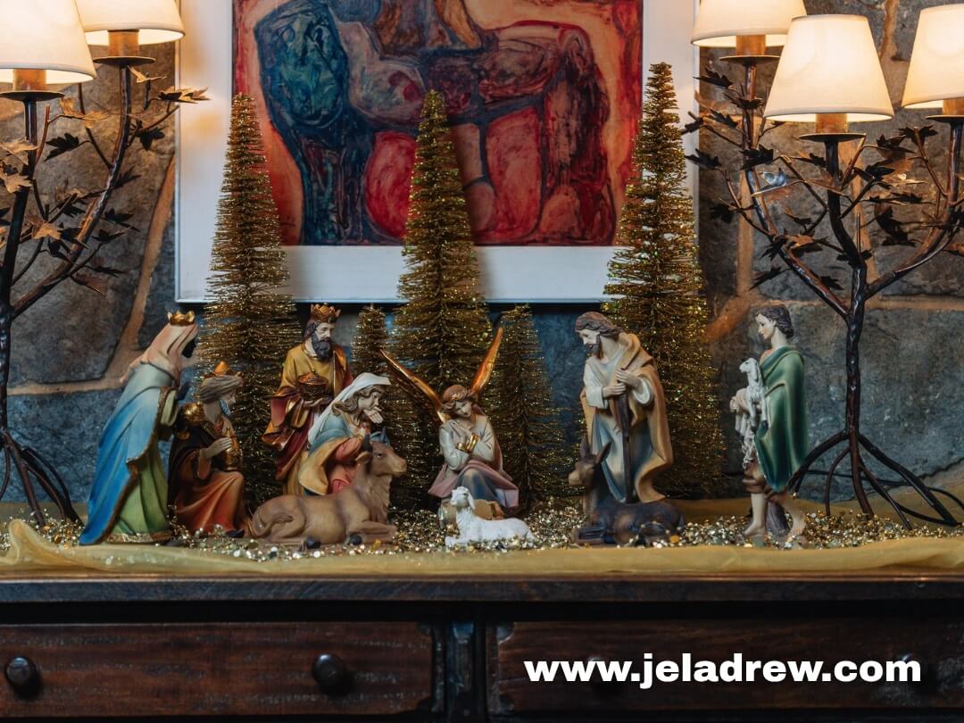 Nativity-scene-with-Mary-Joseph-baby-Jesus-shepherds-wise-men-decorative-trees,-and a golden garland-warmly-lit-for-a-festive-centerpiece.