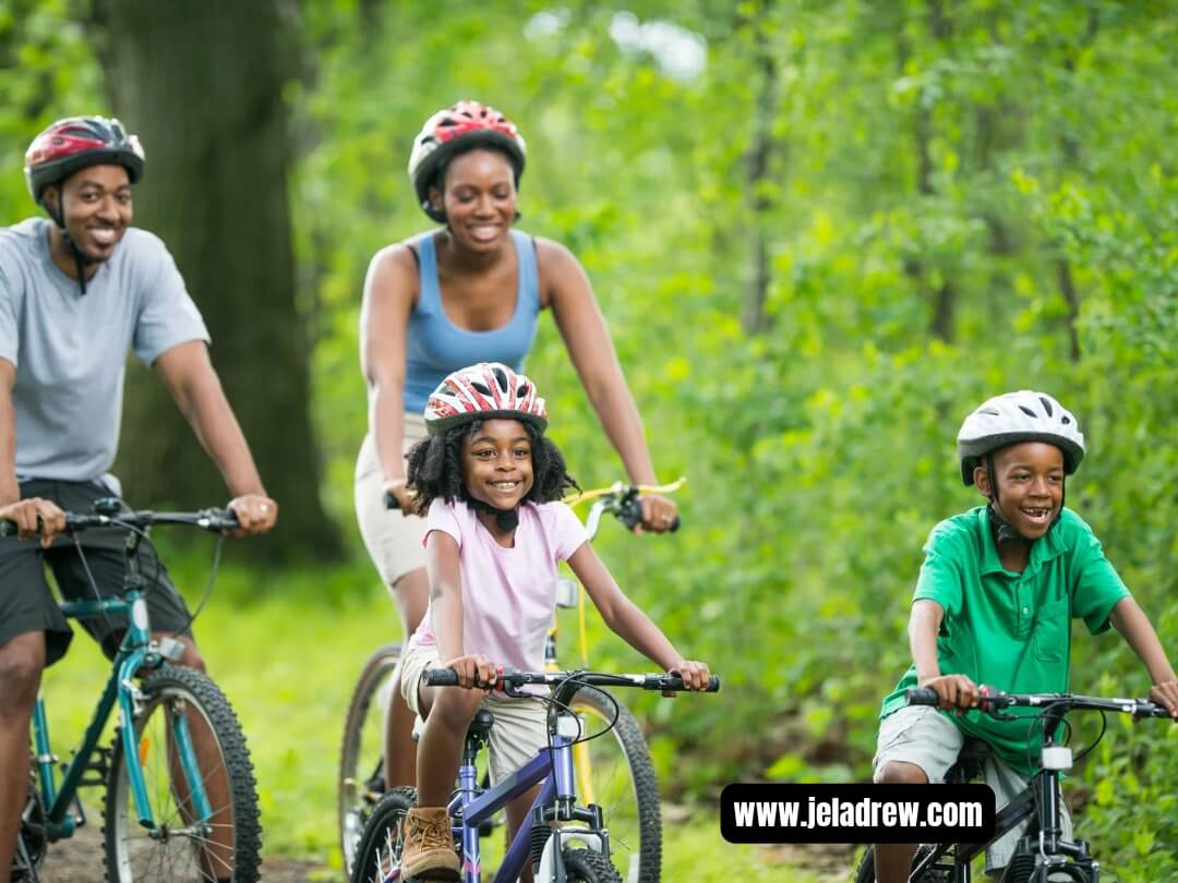 Parents-children-riding-bicycles-to-gether-on-a-green-out-door-trail.