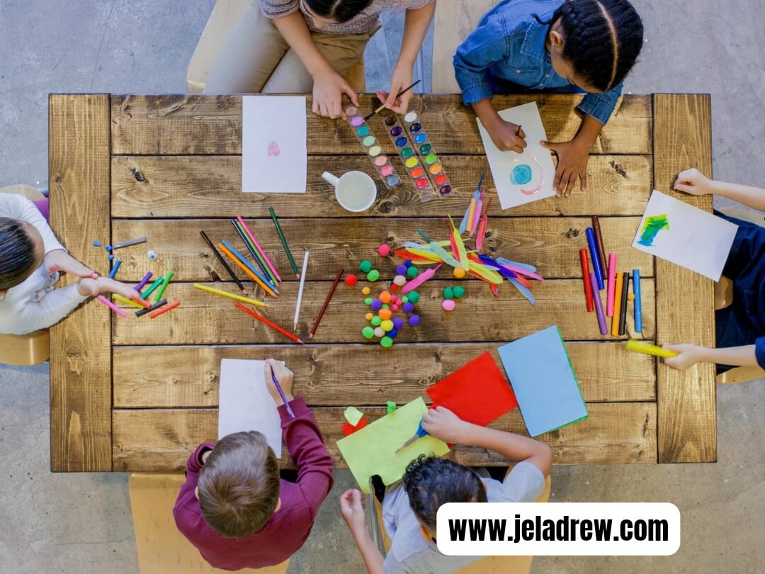 Children-doing-creative-arts-and-crafts-to-gether-with-paper-paints-and-pencils.