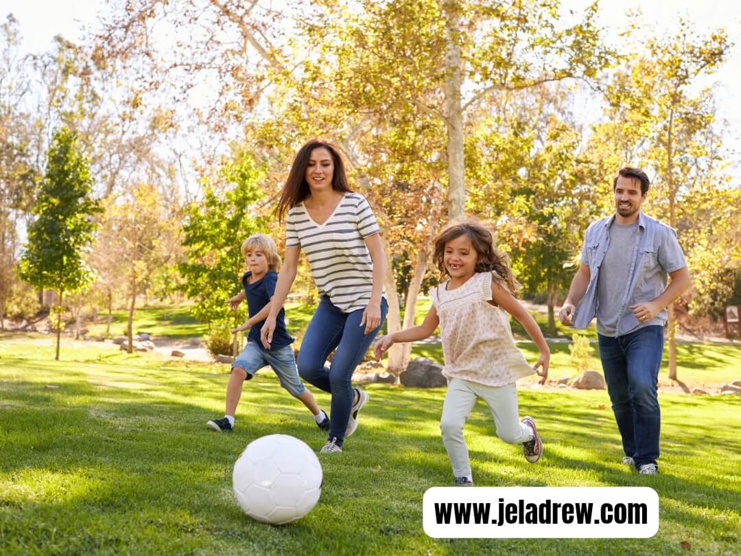 Happy-family-playing-soccer-to-gether-in-a-sunny-park