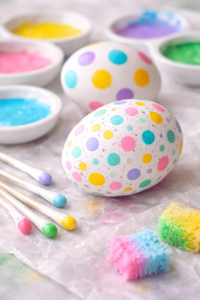 Hand-painted-Easter-eggs-with-colorful-polka-dots-and-craft-supplies