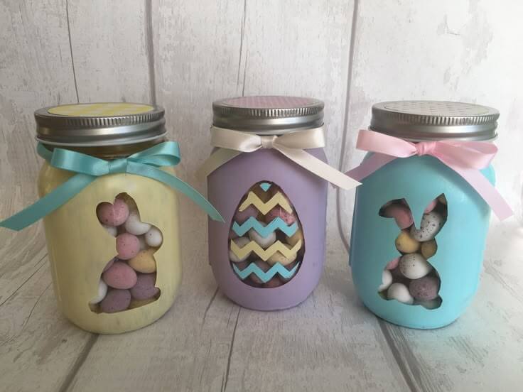 Decorative-mason-jars-with-ribbon-tied-round-pastel-paint-and-zig-zag-Easter-egg-designs