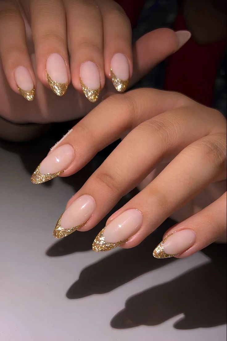Neutral-with-gold-glitter-French-tips-25-festive-St-Patric's-day-nail-ideas-to-try-in-2026