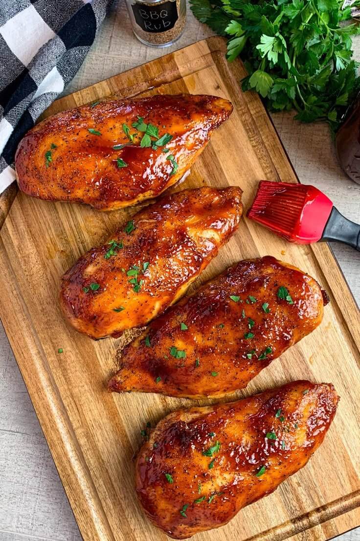 Oven-baked-BBQ-chicken-breasts-on-a-wooden-board