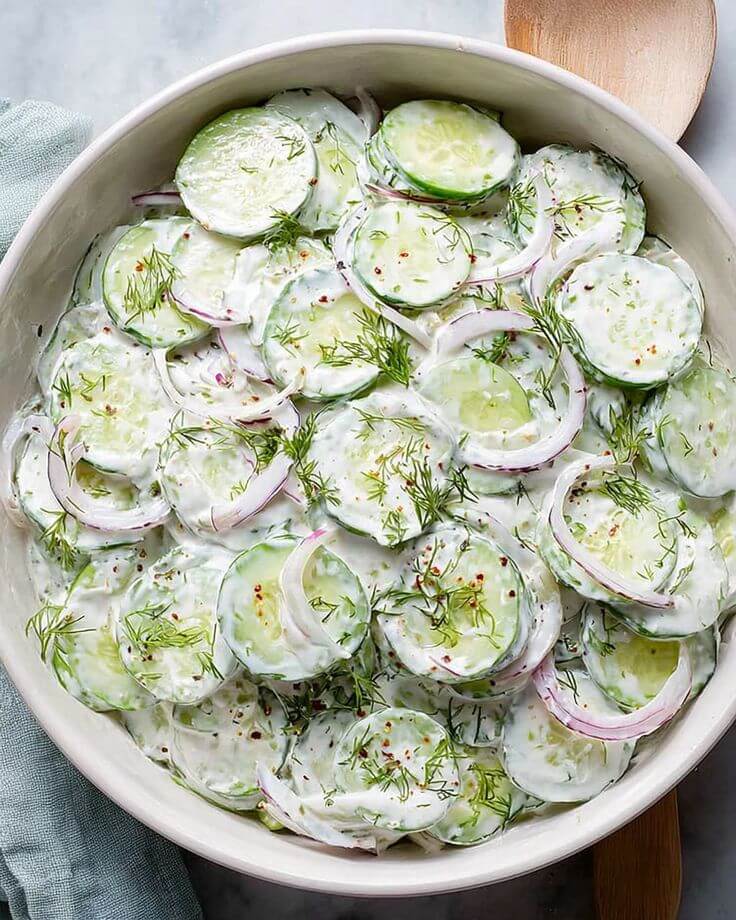 Creamy-cucumber-salad-with-sliced-cucumbers-onions-and-dill-dressing