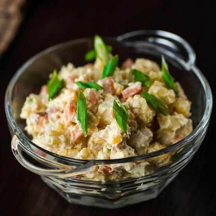 Creamy-potato-salad-with-herbs-in-a-glass-bowl-15-delicious-4th-of-july-side-dishes